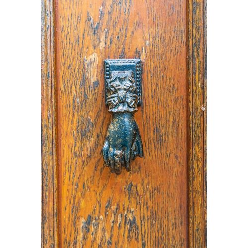 France-Dordogne-Hautefort A metal door knocker in the shape of a hand in the town of Hautefort
